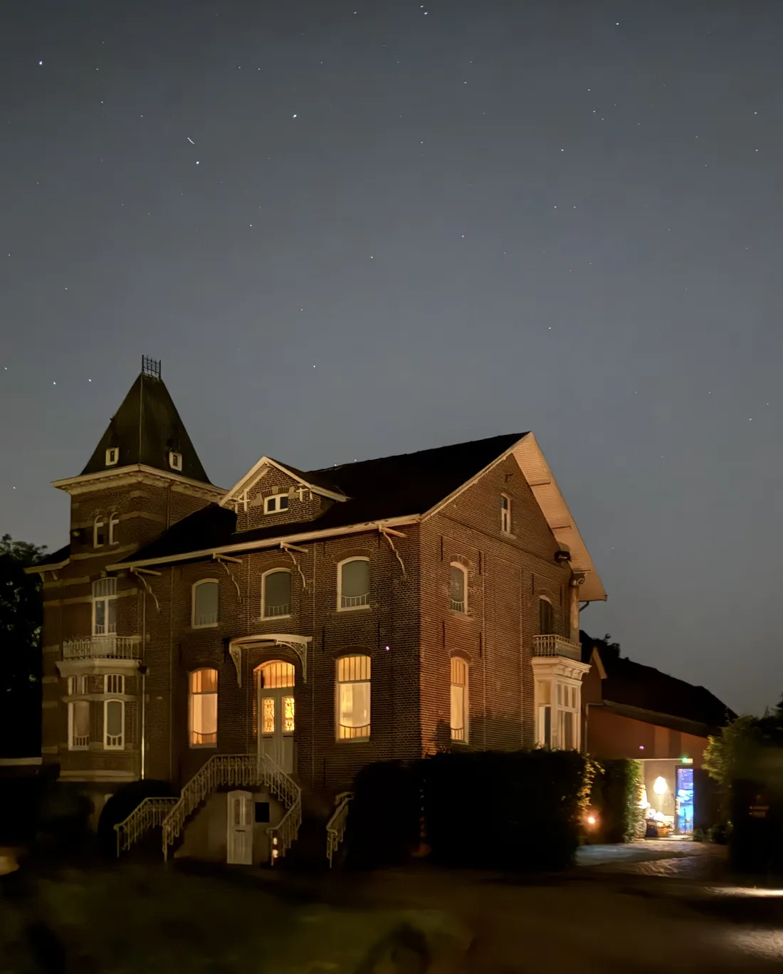 The villa of The House of Eros in Ghent, lit up at night
